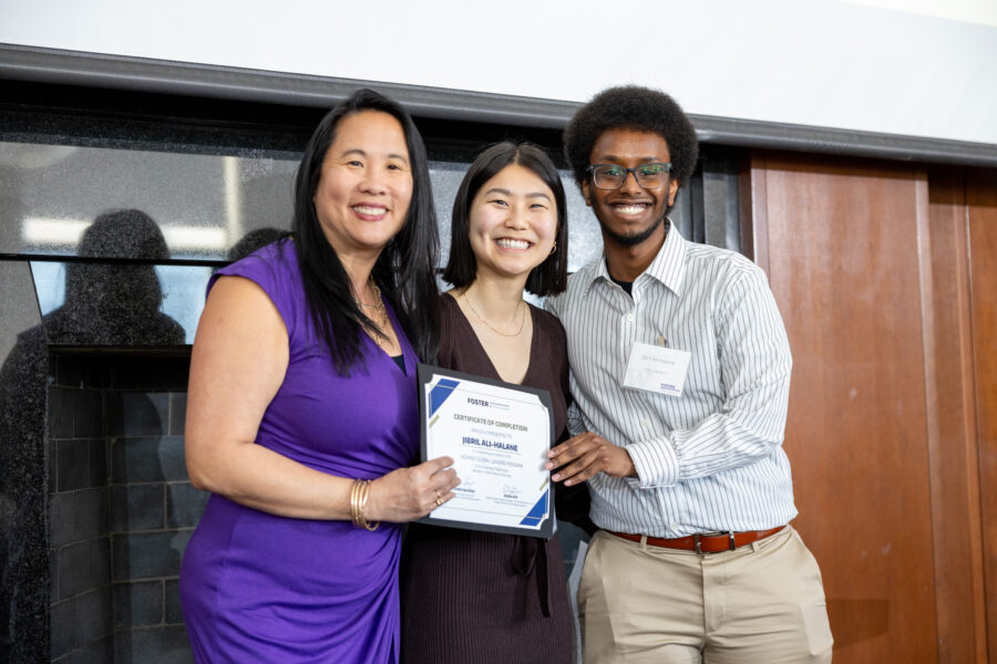 Jibril Ali Halane (right) posing with Foster staff, Christina Fong (left) and Eileen Guo (center), as he received his Certificate of Completion from the Hovind Global Leaders Program in 2024.
