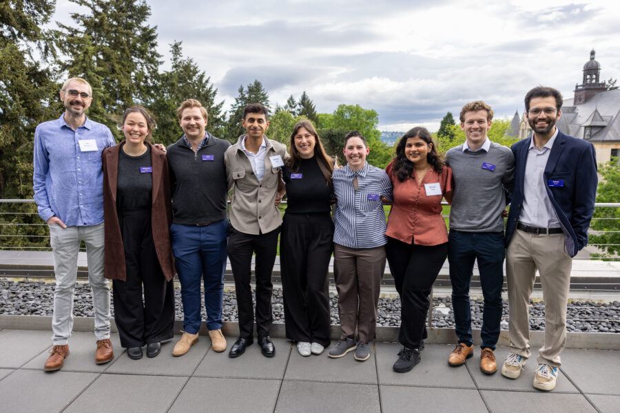 The 2026 incoming Fritzky Fellows posing on the balcony at Founders Hall at the end-of-year Fritzky dinner.