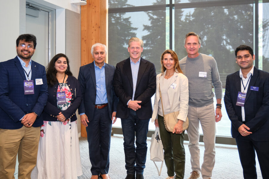 Ally Svenson (3rd from right) and Scott Svenson (2nd from left) posing with AI Spark Day participants.