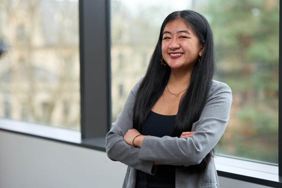 Krisanta Bolante, 2026 Poets&Quants Best & Brightest Undergraduate Business Majors, posing at Founders Hall. 