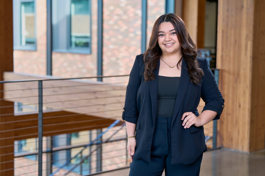 Lindsay Garza, 2025 Poets&Quants Best & Brightest Undergraduate Business Majors, posing in Founders Hall.