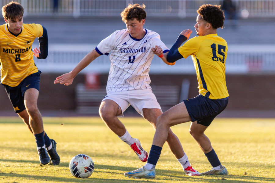 Nick O’Brien (center) in action during Game One of the Big Ten Men's Soccer Tournament between Michigan and Washington in College Park, Maryland. (Photo by Austin DeSisto/Big Ten/University Images via Getty Images)