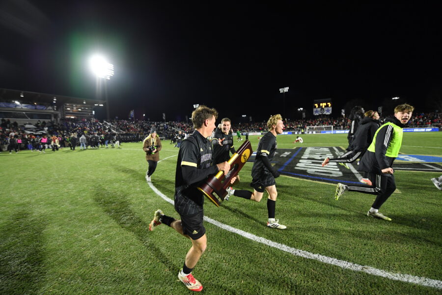 Nick O’Brien and his teammates celebrating with the NCAA Division I Men's College Cup National Championship trophy.