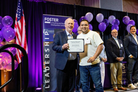 Michael Verchot, Founding Director of the Consulting and Business Development Center, handing out certificates to students at the 2026 graduation ceremony.