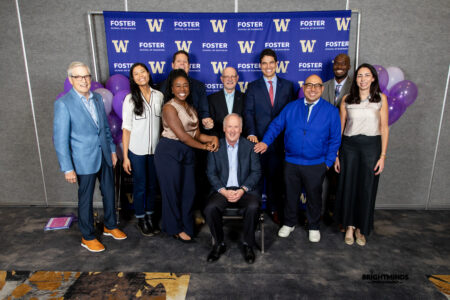 Program staff and supporters pose at the 2026 graduation ceremony around Michael Verchot, Founding Director of the Consulting and Business Development Center.