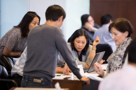 UW Global Banking Program students from the 2015 cohort working together on a group project.