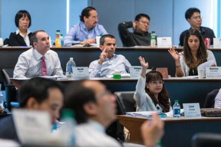 A group of students attending a class in the Global Banking Program